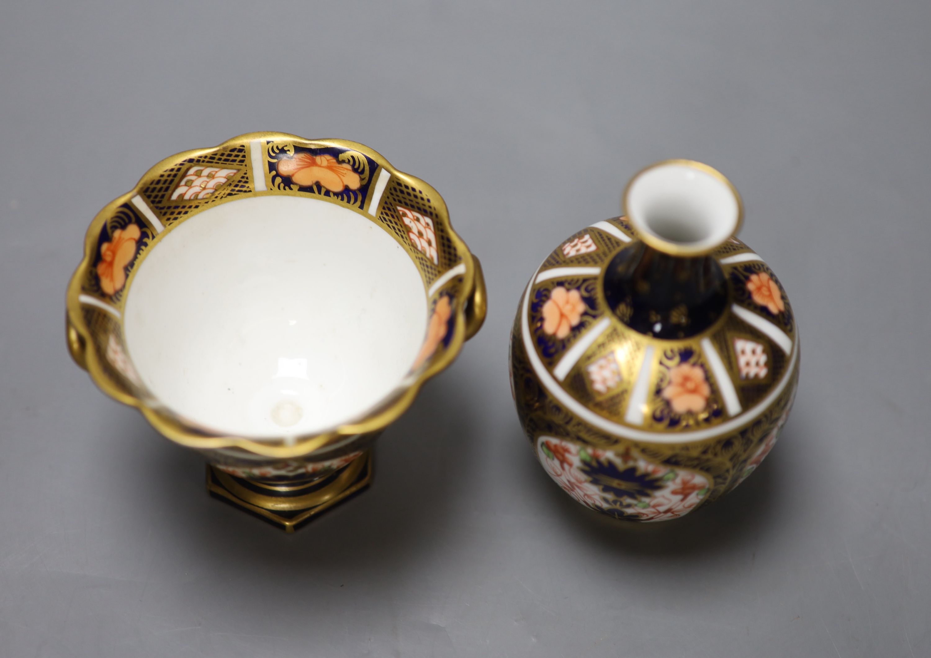 A Royal Crown Derby ovoid vase painted with pattern 1128 and a two handled vase, tallest 11cm